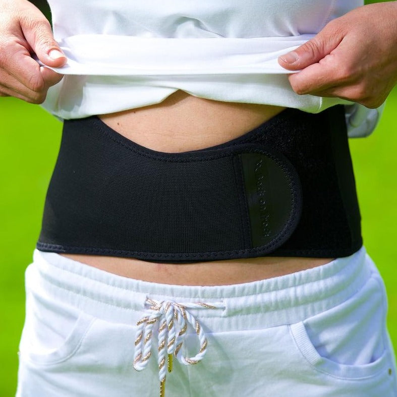 Ceinture lombaire aux effets thermiques agissant pour soulager les douleurs du bas du dos Back On Track portée